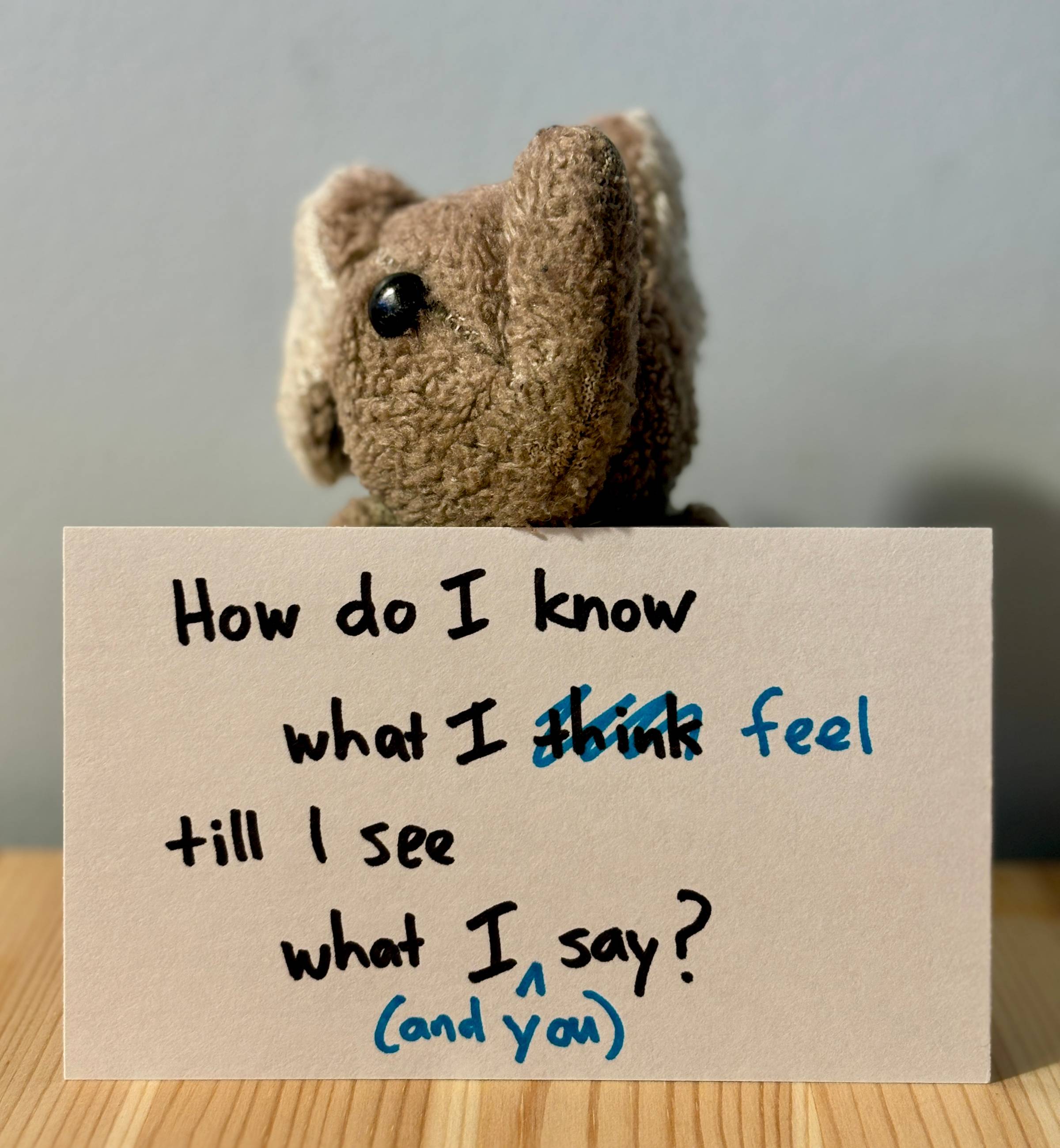 Paul with an index card that reads "How do I know what I feel till I see what I (and you) say?"