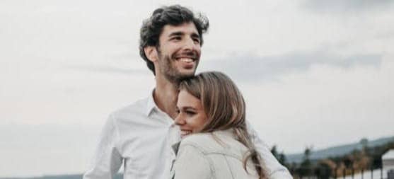 man and woman hugging each other