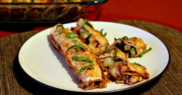 Vegan enchiladas with potato and veggie filling