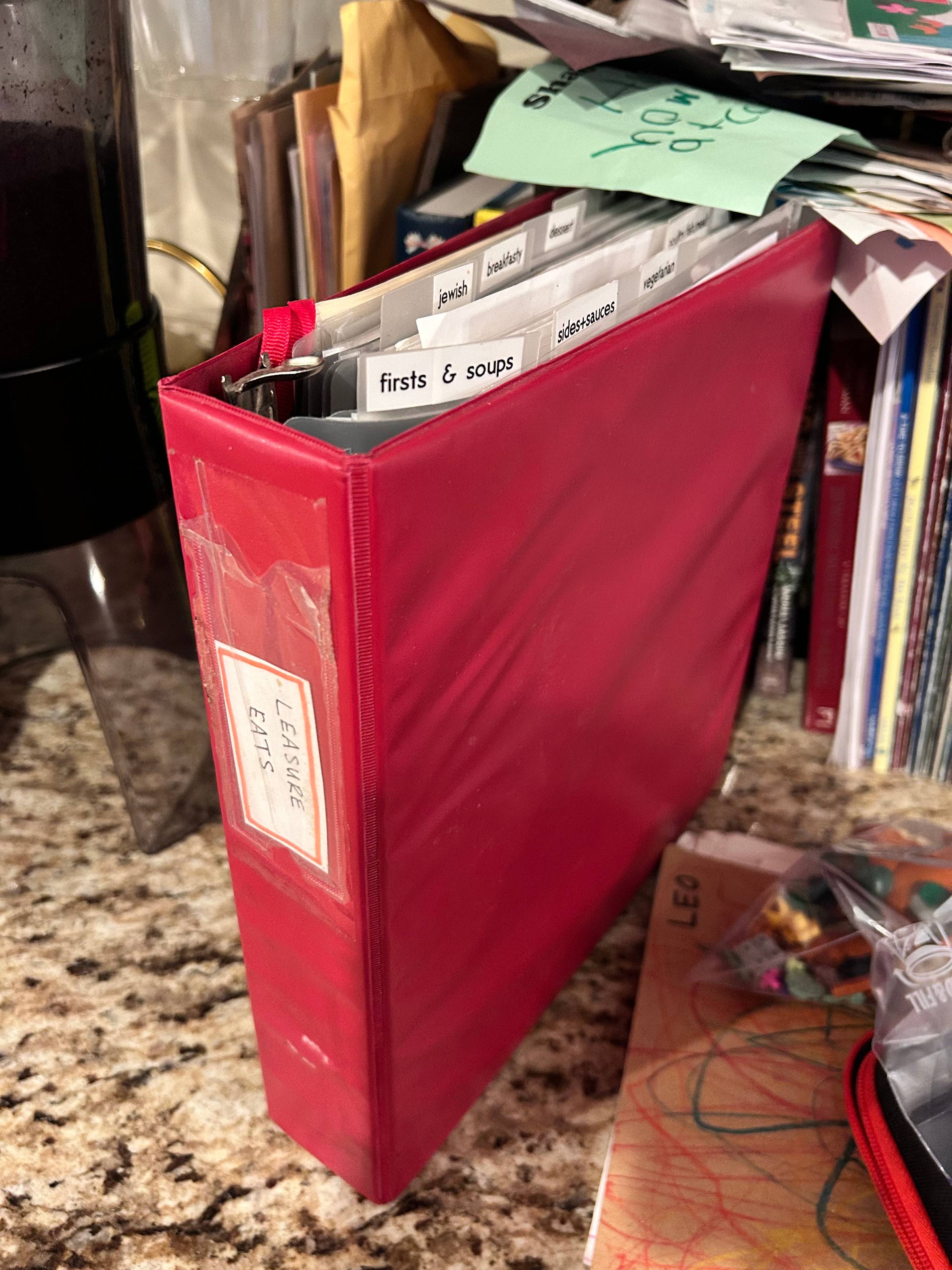 red 3-ring binder titled "Leasure Eats", with tabbed sections for each type of recipe