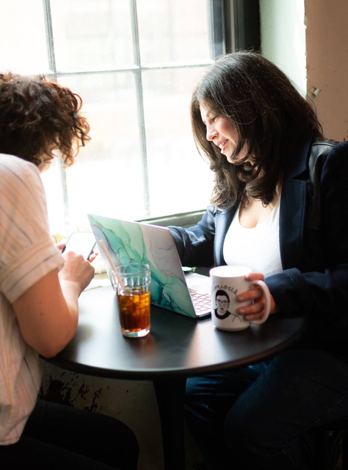 carolyn leasure, founder and creative director of Maypop Creative Studio, working with a client