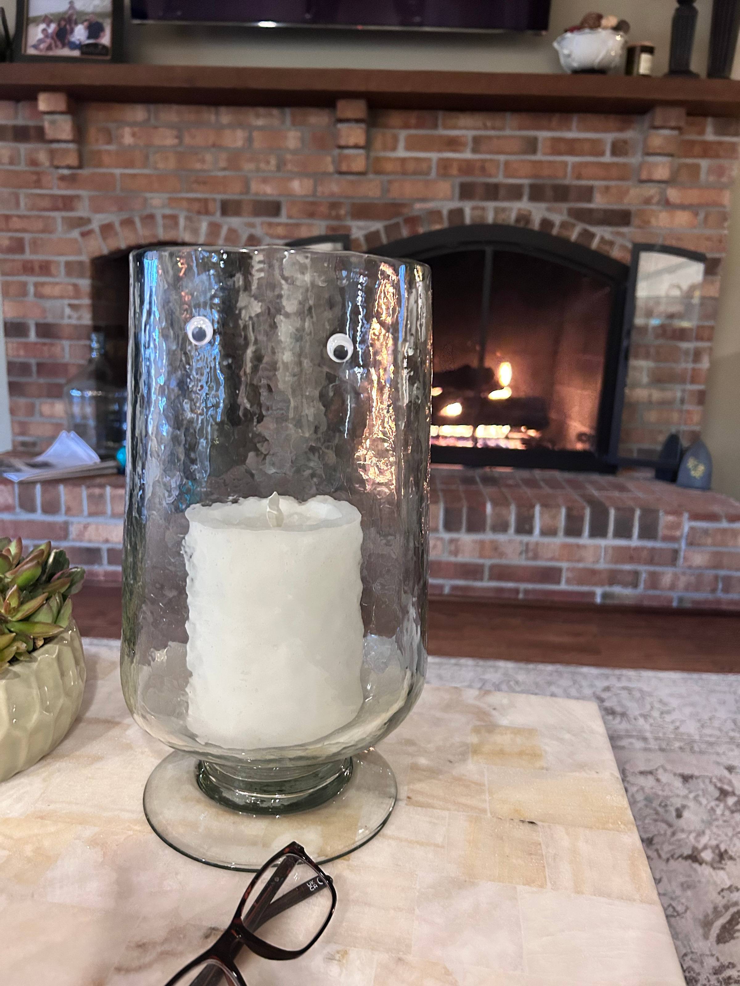 googly eyes on a big ass candle holder