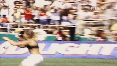 brandi chastain tearing off her shirt after soccer win