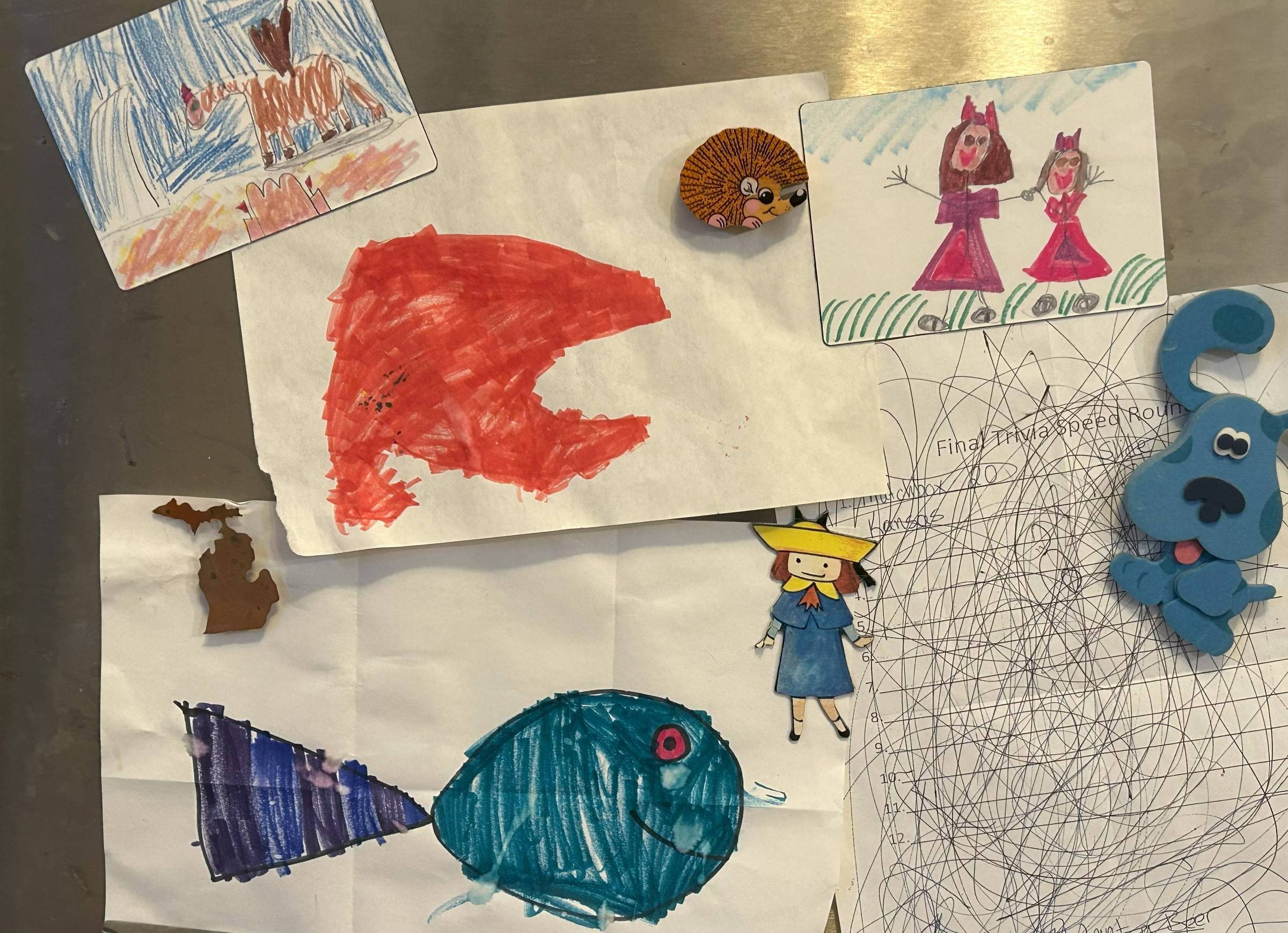 Children's artwork on a refrigerator