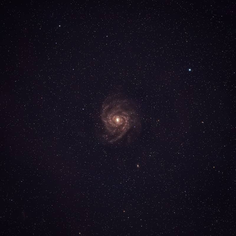 A beautiful spiral galaxy surrounded by stars.