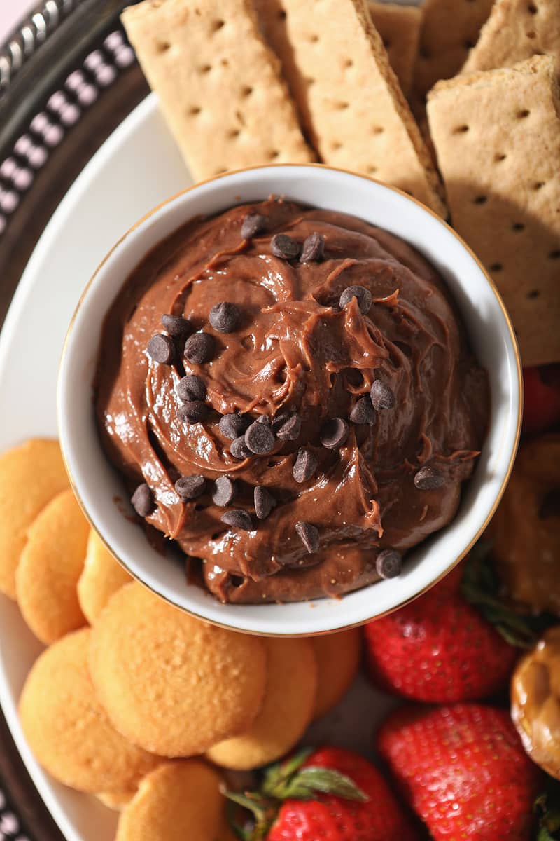 Bowl of Chocolate Cheesecake Dip surrounded by dippers