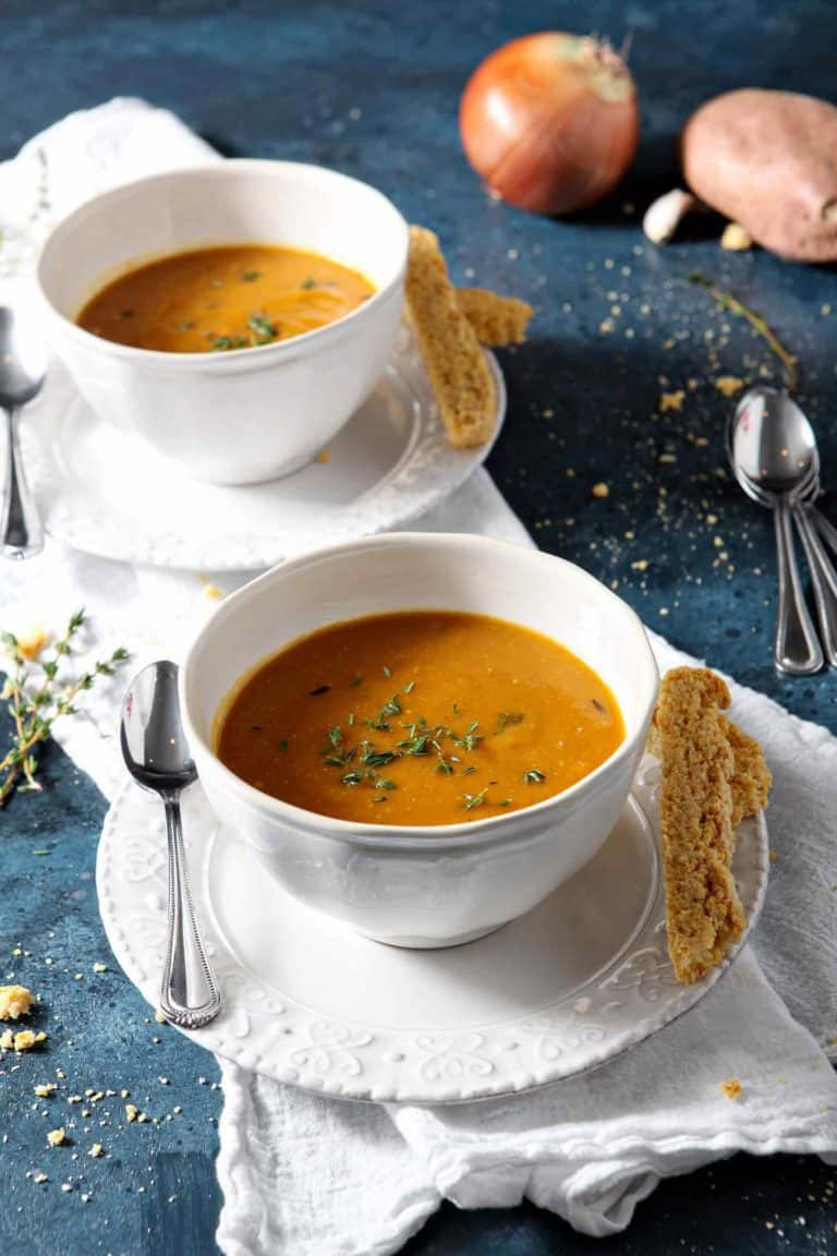 two bowls of sweet potato soup