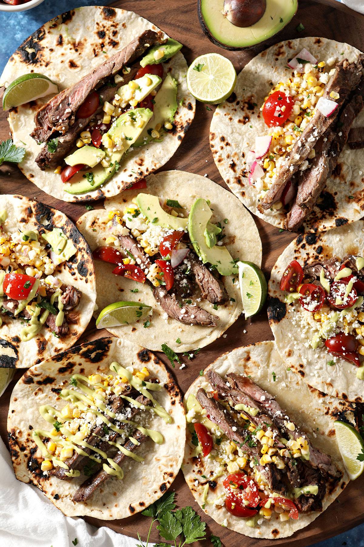 skirt steak tacos on a board
