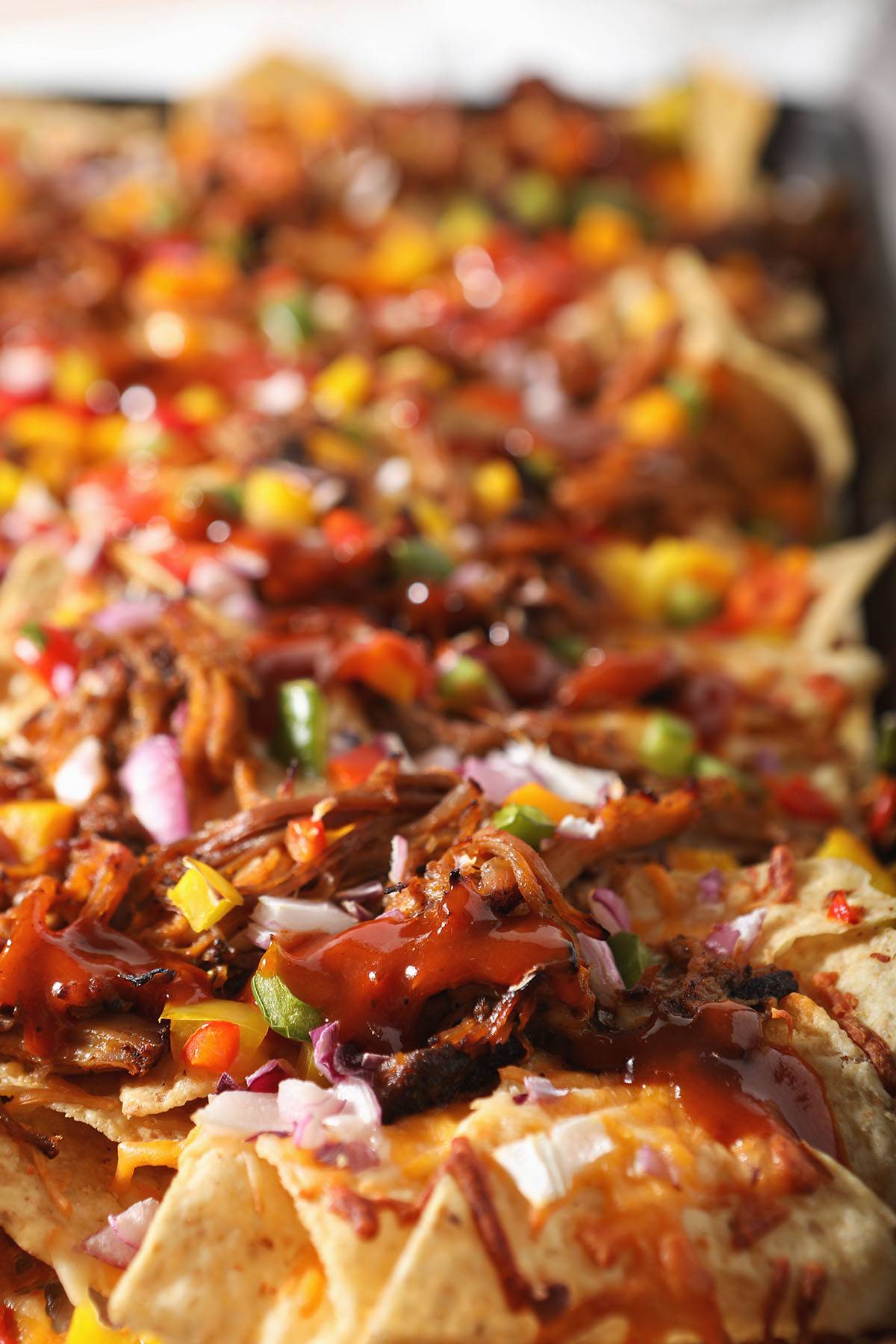 BBQ nachos in a pan before serving