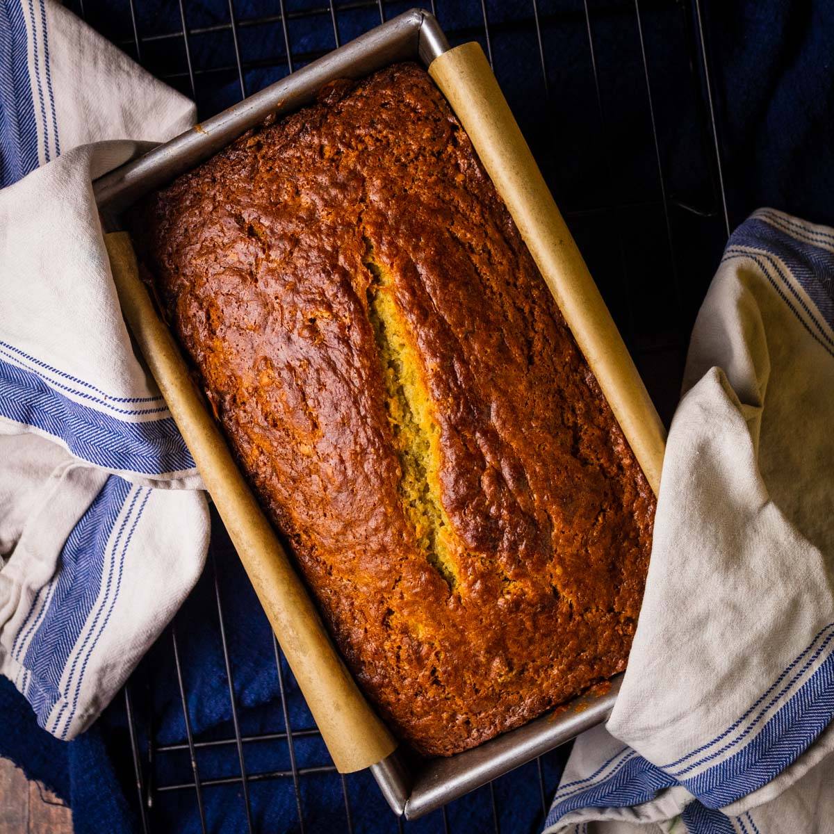 loaf of baked banana bread in a loaf pan.