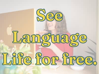 See Language Life free text on background of Lindsay at computer.