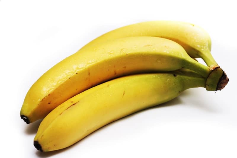 A couple of bananas sitting next to each other