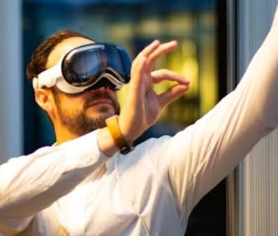 a man in a white shirt wearing a pair of virtual glasses