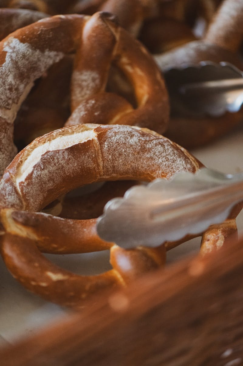 A table topped with pretzels and a spoon