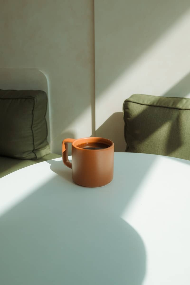 A cup of coffee sitting on a table