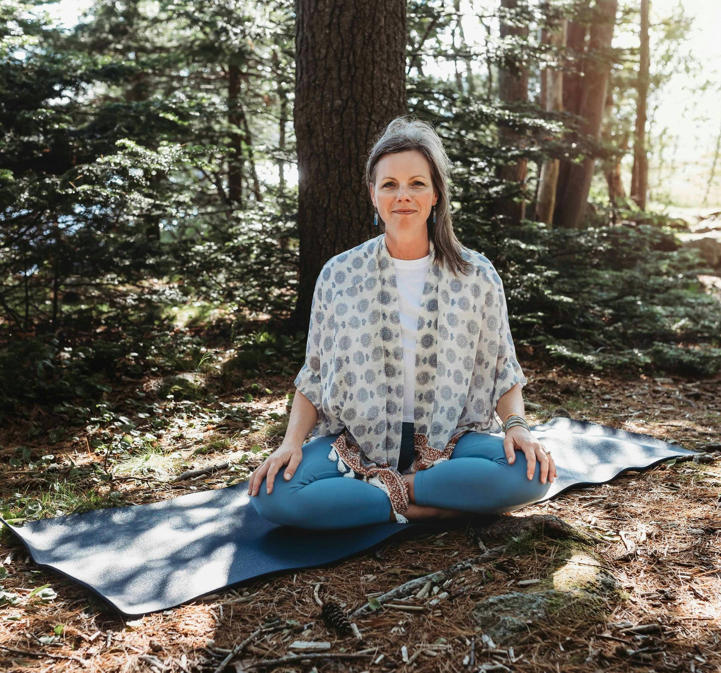Michelle Robinson AUMatHOME seated in the forrest