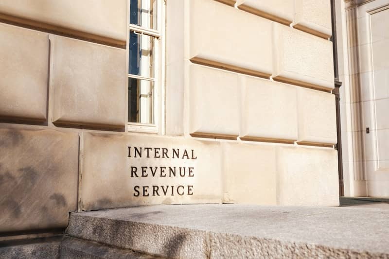 A close up of a building with a sign on it that says, "Internal Revenue Service".