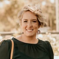 Head shot od Sam Dellamarta, a woman with short blonde hair.
