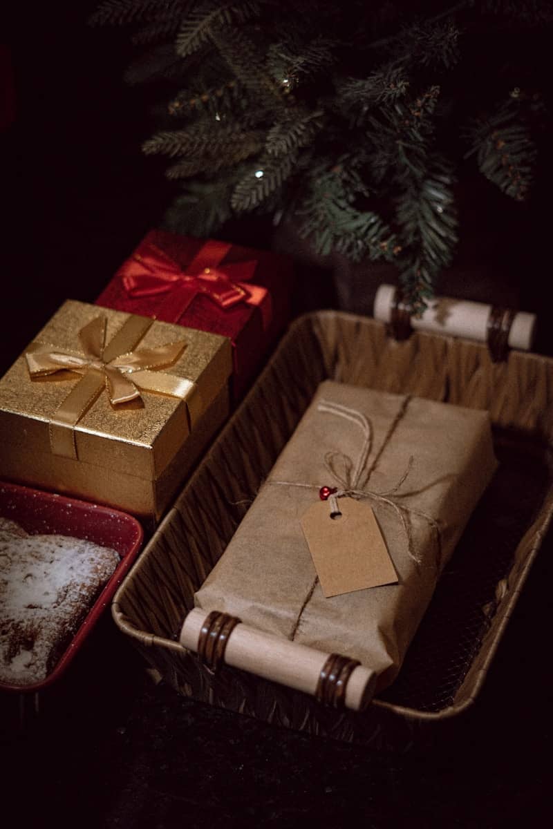 A christmas tree with presents wrapped in brown paper