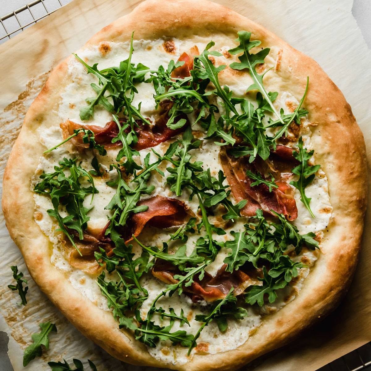 Pizza with fresh arugula.