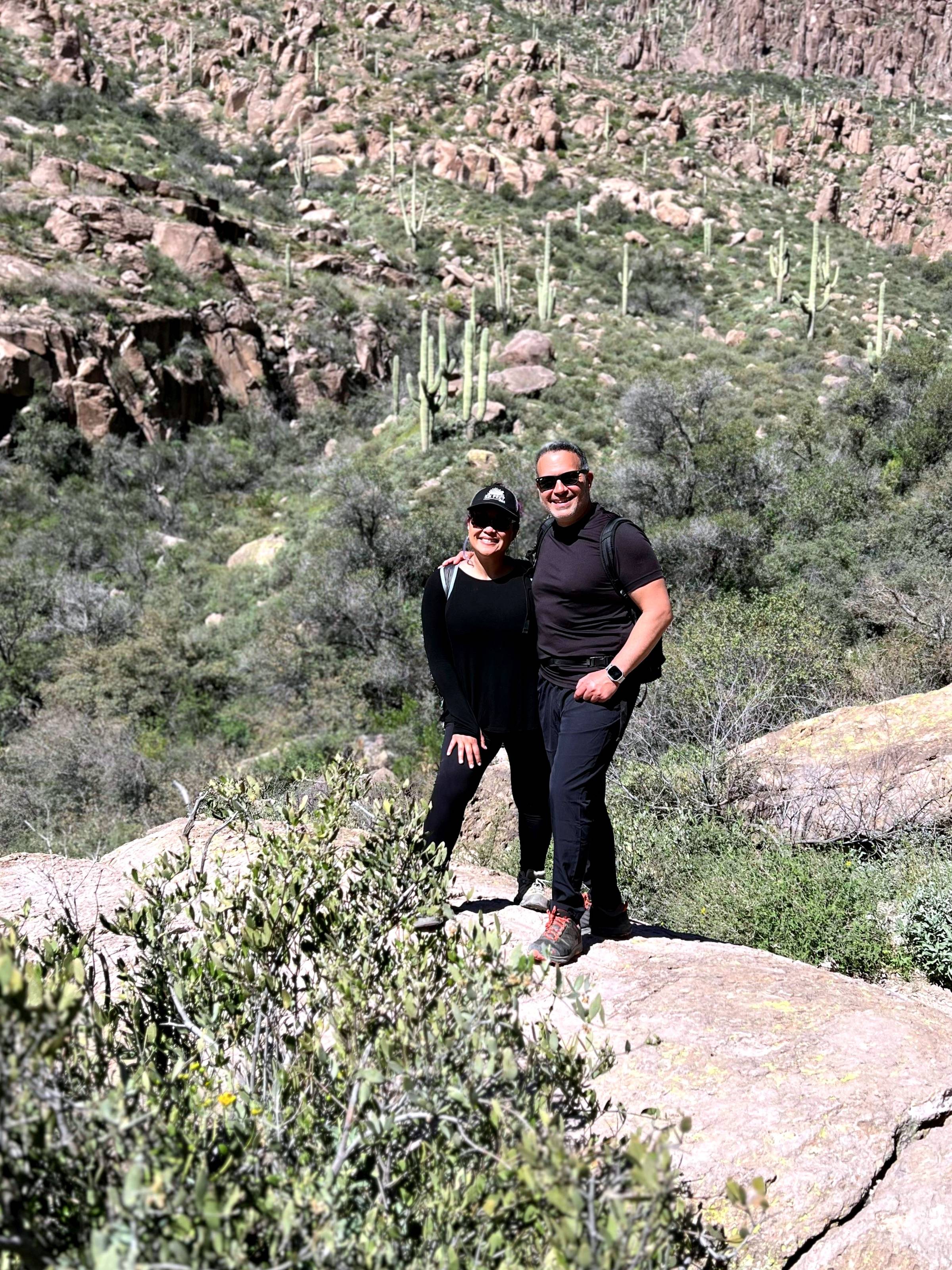 Cheryl and Jack posing mid-hike in Phoenix, Arizona.