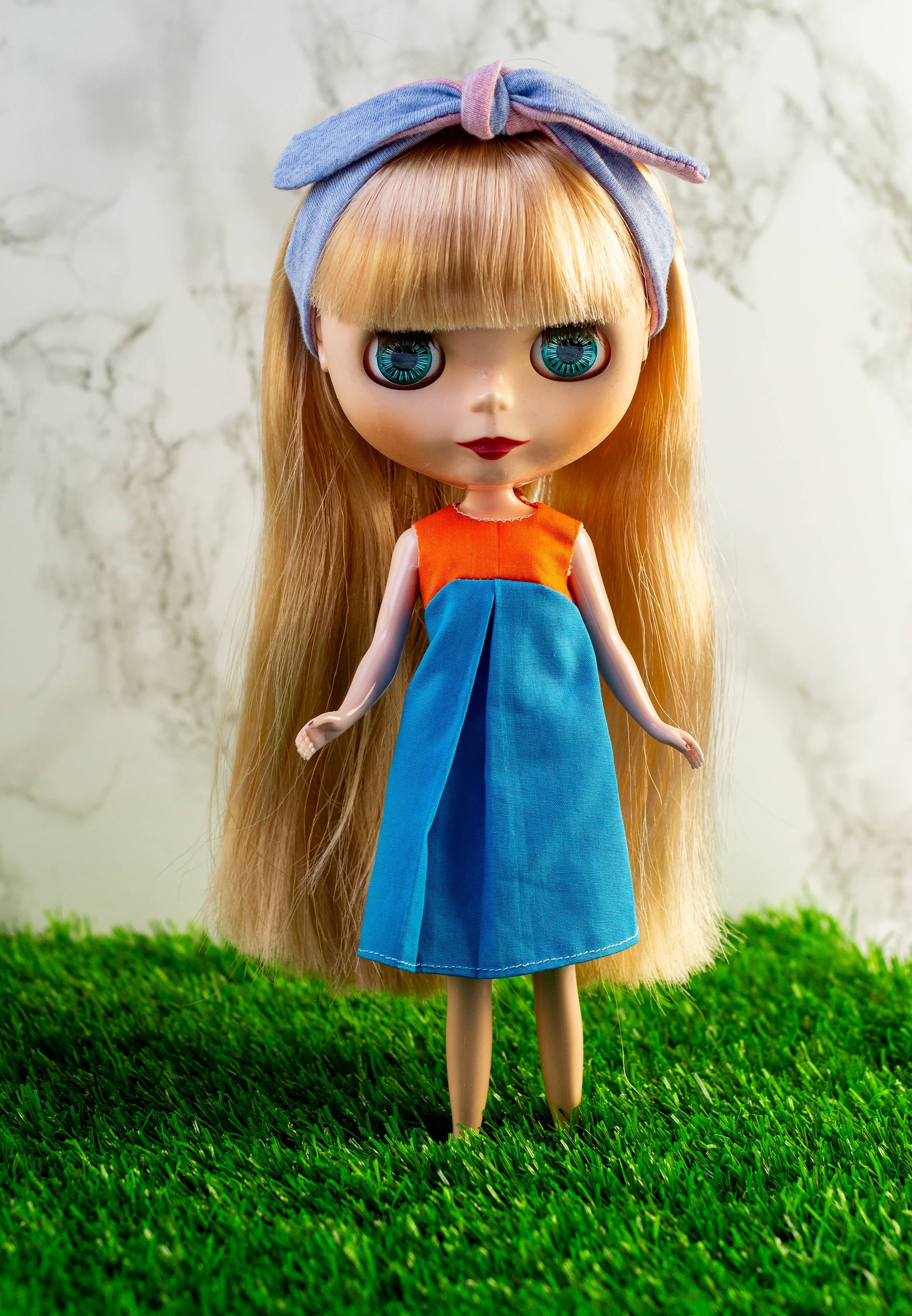 A dirt road surrounded by trees and mountains