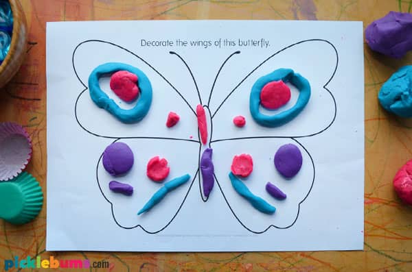 Butterfly template used as a playdough mat