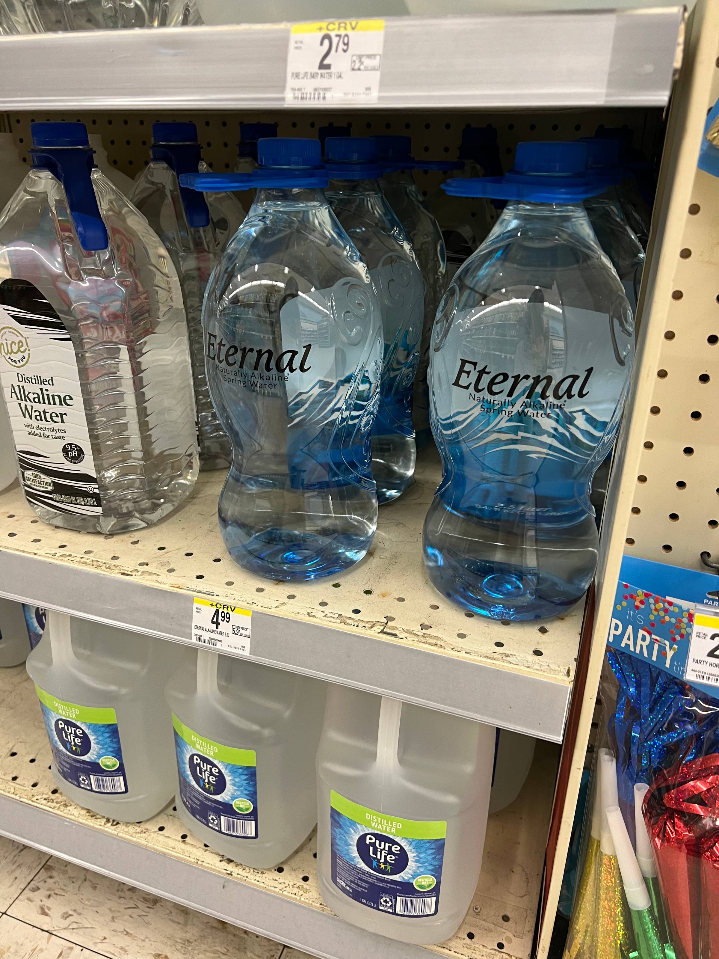 hourglass shaped waterbottles labeled "Eternal" on a store shelf