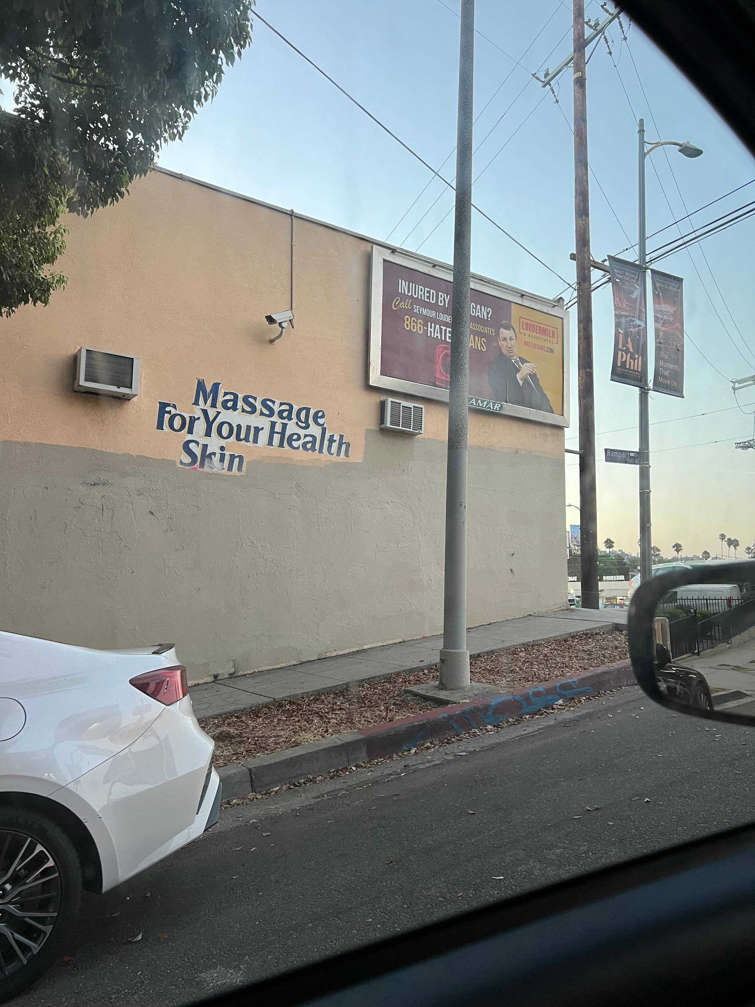 side of building with "Massage For Your Health Skin" painted on the side