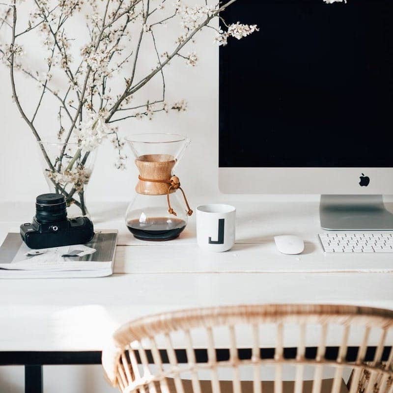 silver imac on white table