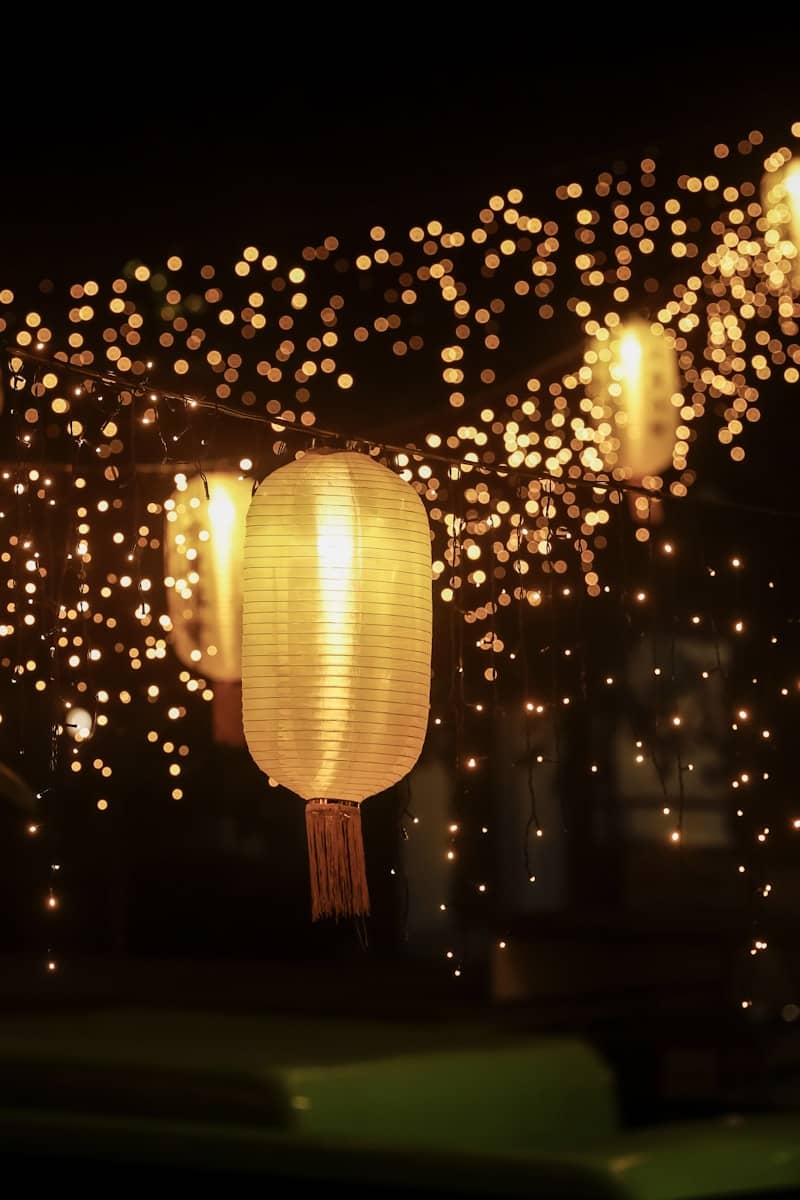 Glowing lanterns and string lights at night