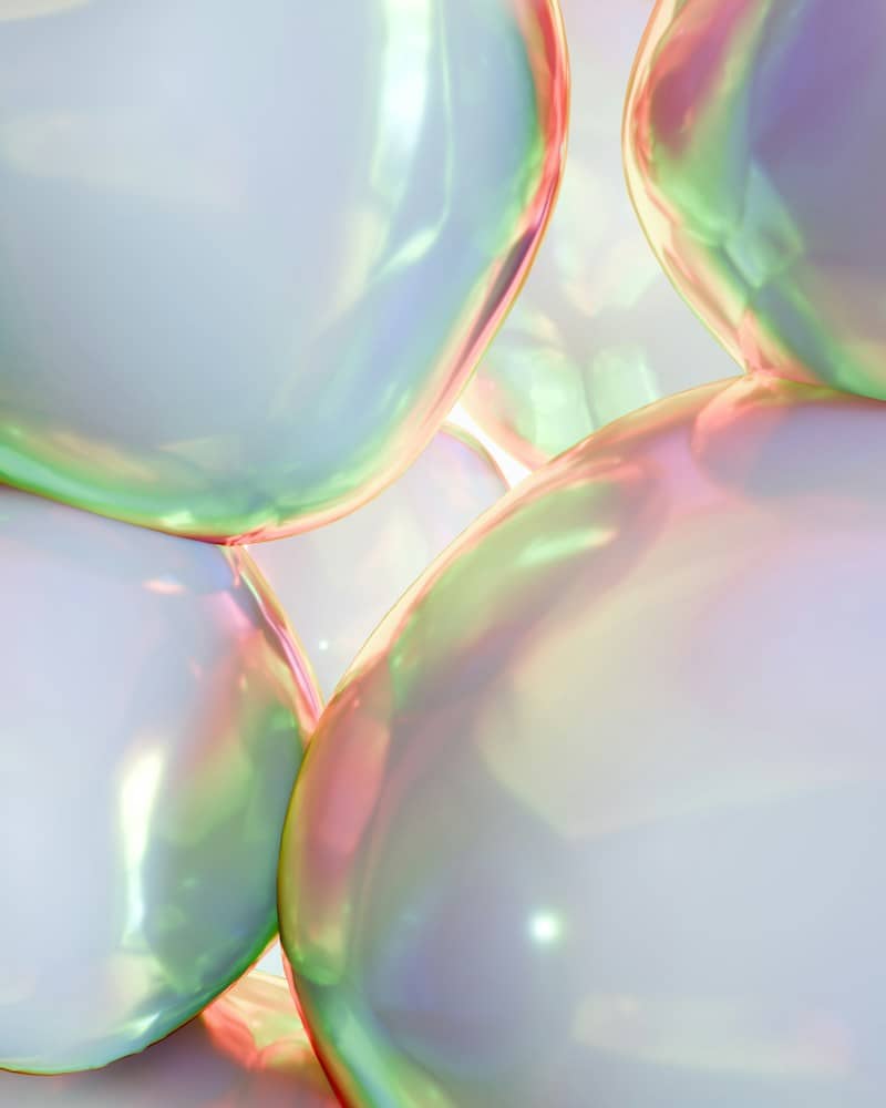 Close-up of iridescent, translucent spheres with soft light