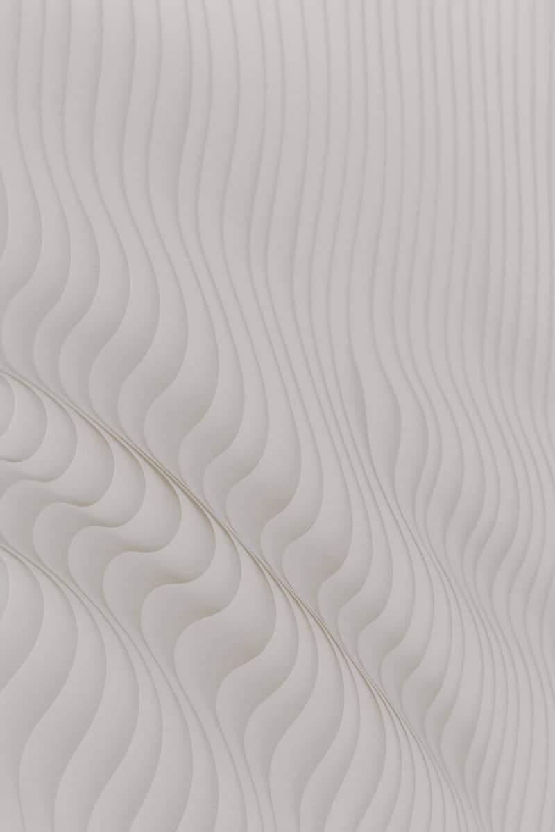 Abstract white curving lines create a textured surface.