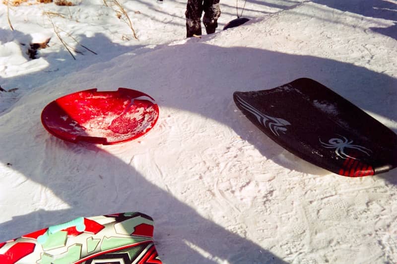 Two sleds on a snowy hill | Nat Lockhart | Fitter @ 50