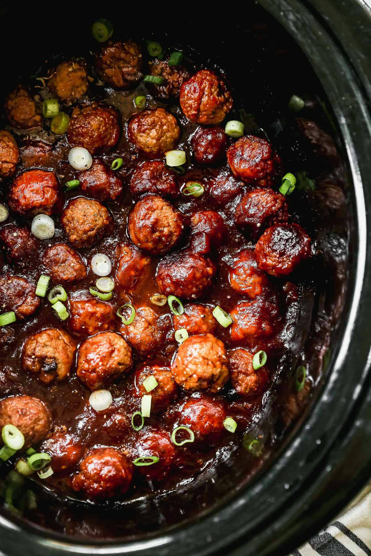 Hawaiian Meatballs garnished with green onion 