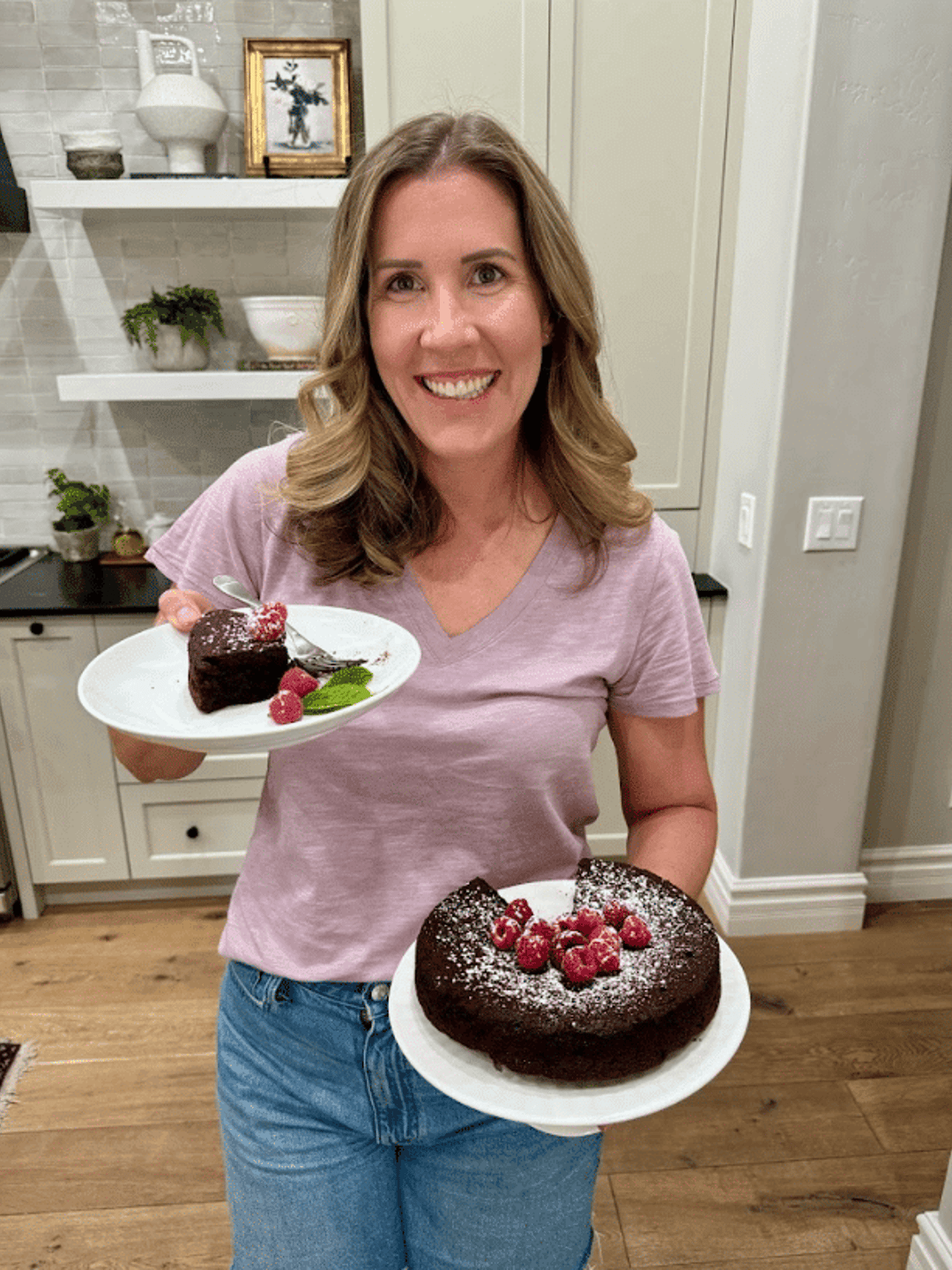 Lauren holding Flourless Chocolate Cake.