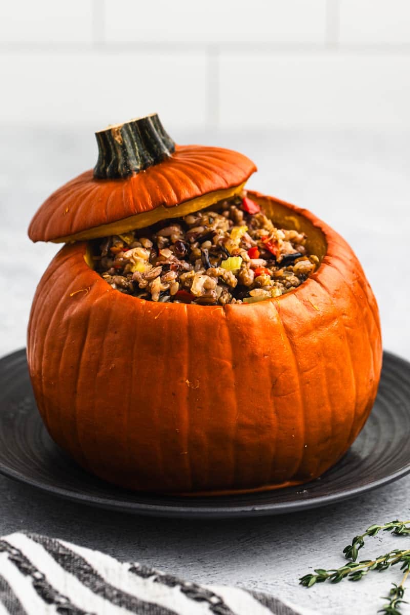 Dinner in a pumpkin made with Italian sausage, wild rice, and vegetables