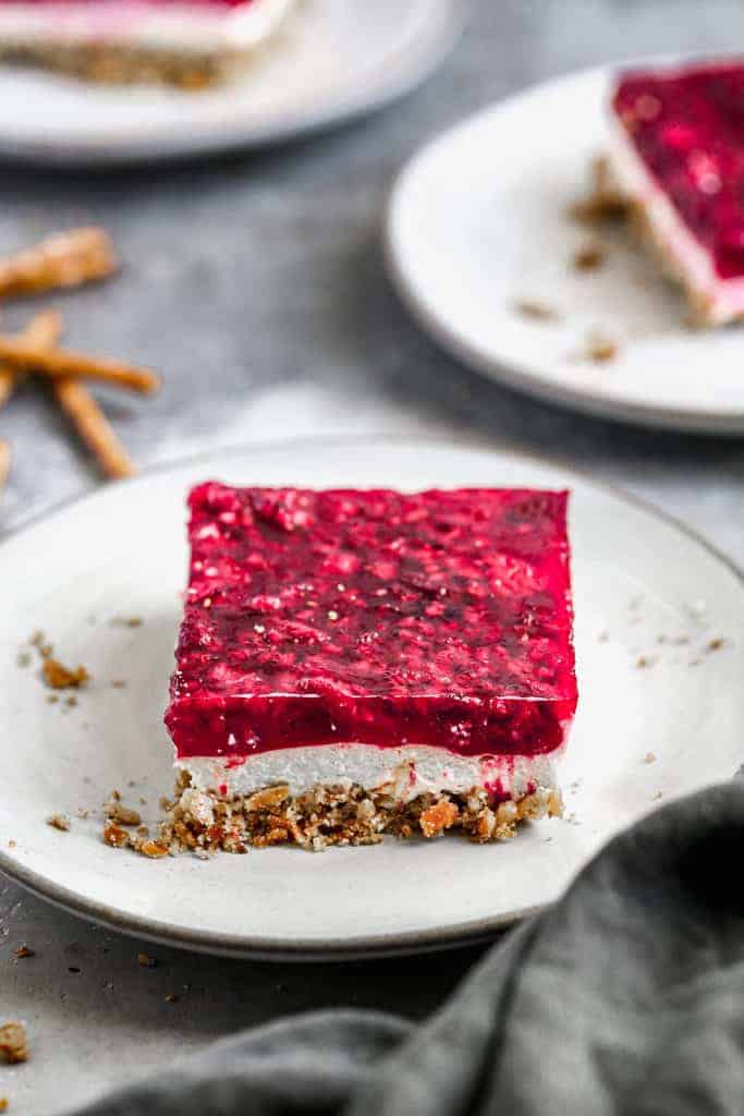 3 layered dessert with pretzel bottom, creamy middle and Jell-o raspberry top