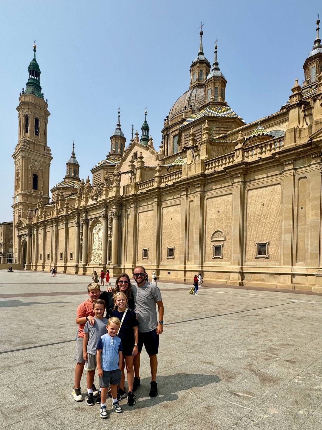 Allen family standing in front of Basilica of Our Lady of the Pillar.