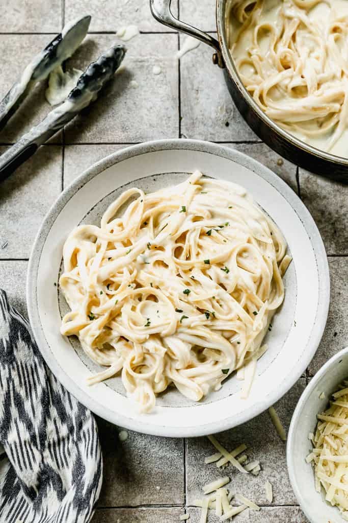 Fettuccine Alfredo in a grey and white bowl