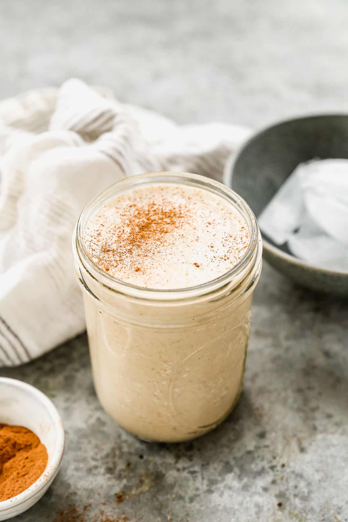 Vanilla Protein Shake in a mason jar with a sprinkle of cinnamon