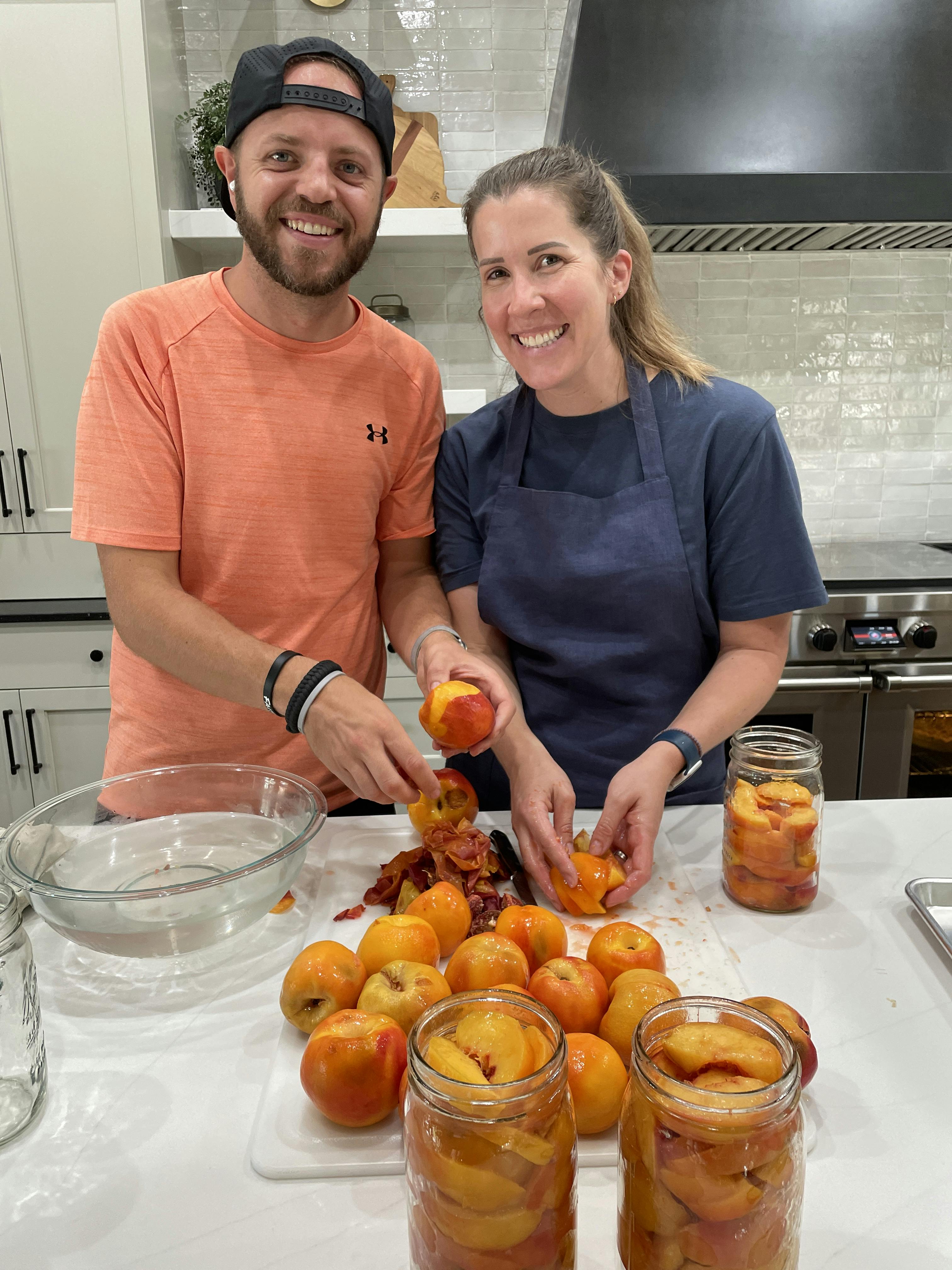 Jeff and Lauren canning peaches.