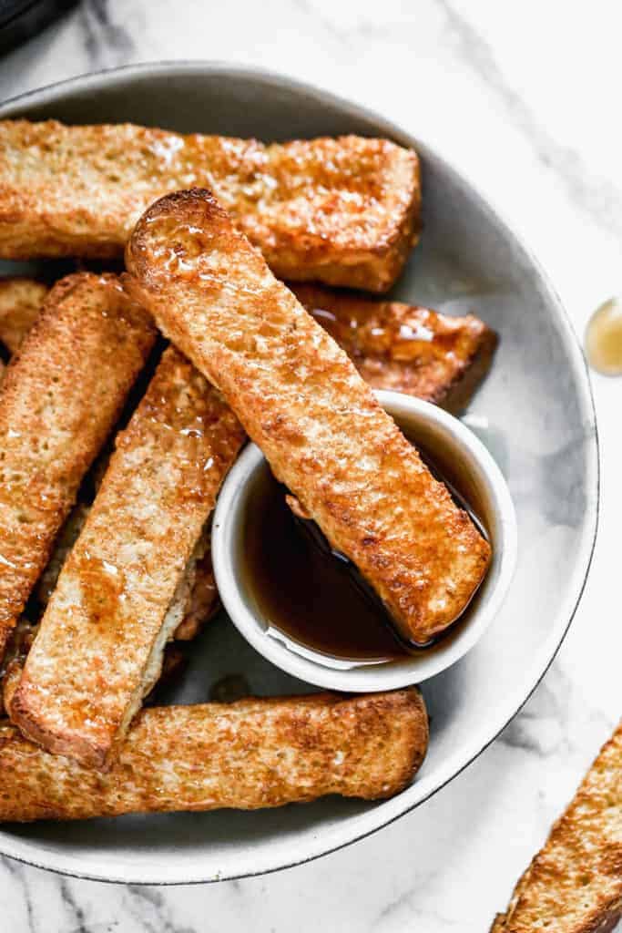 Air Fryer French Toast cut into sticks so you can dip it in maple syrup!