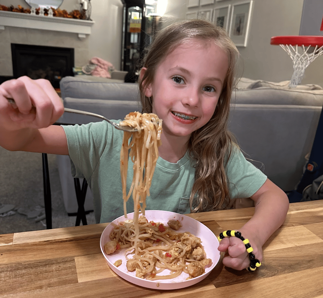 Child with Pad Thai.