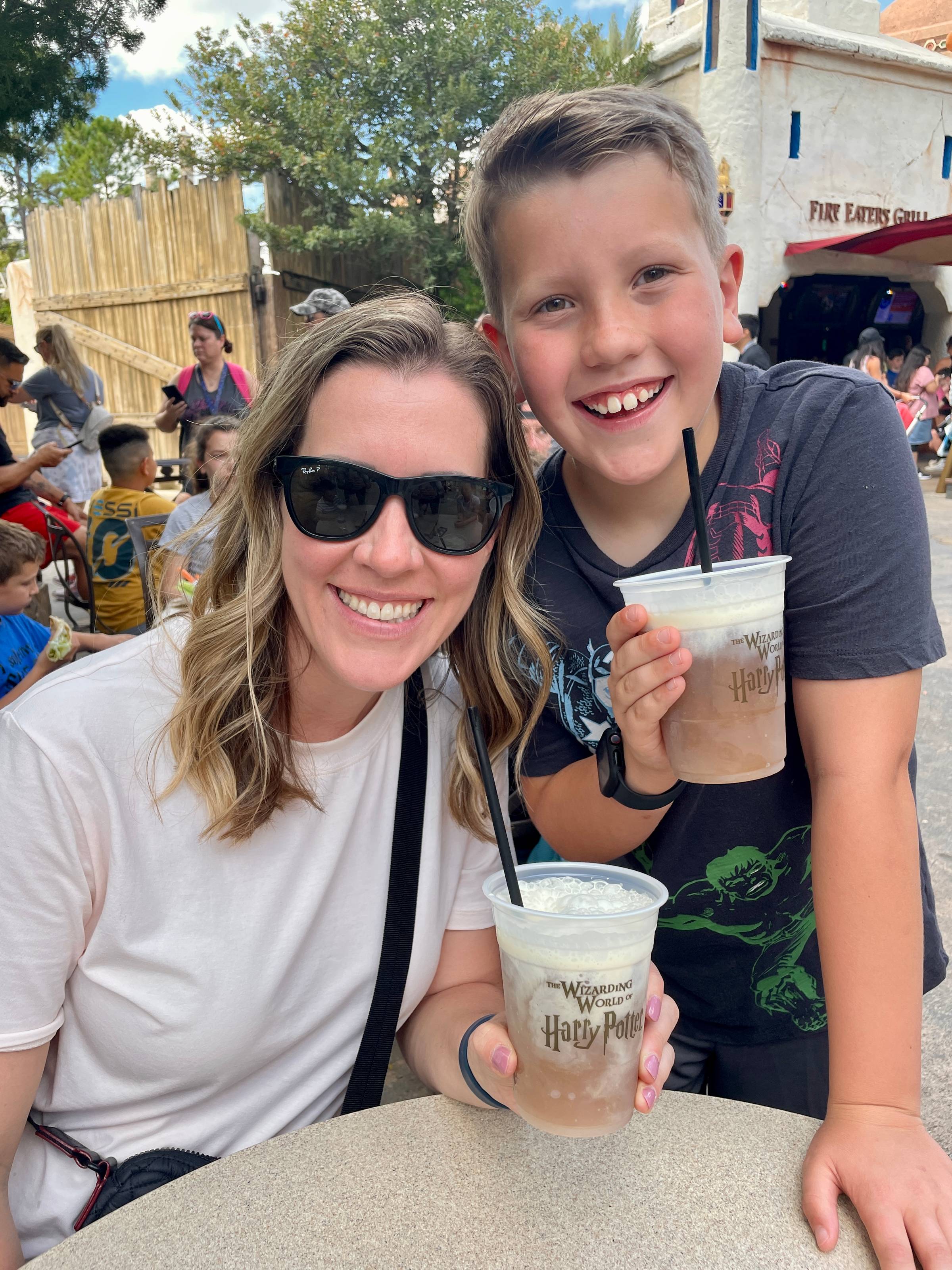 Lauren and her son at Harry Potter World drinking butterbeer 