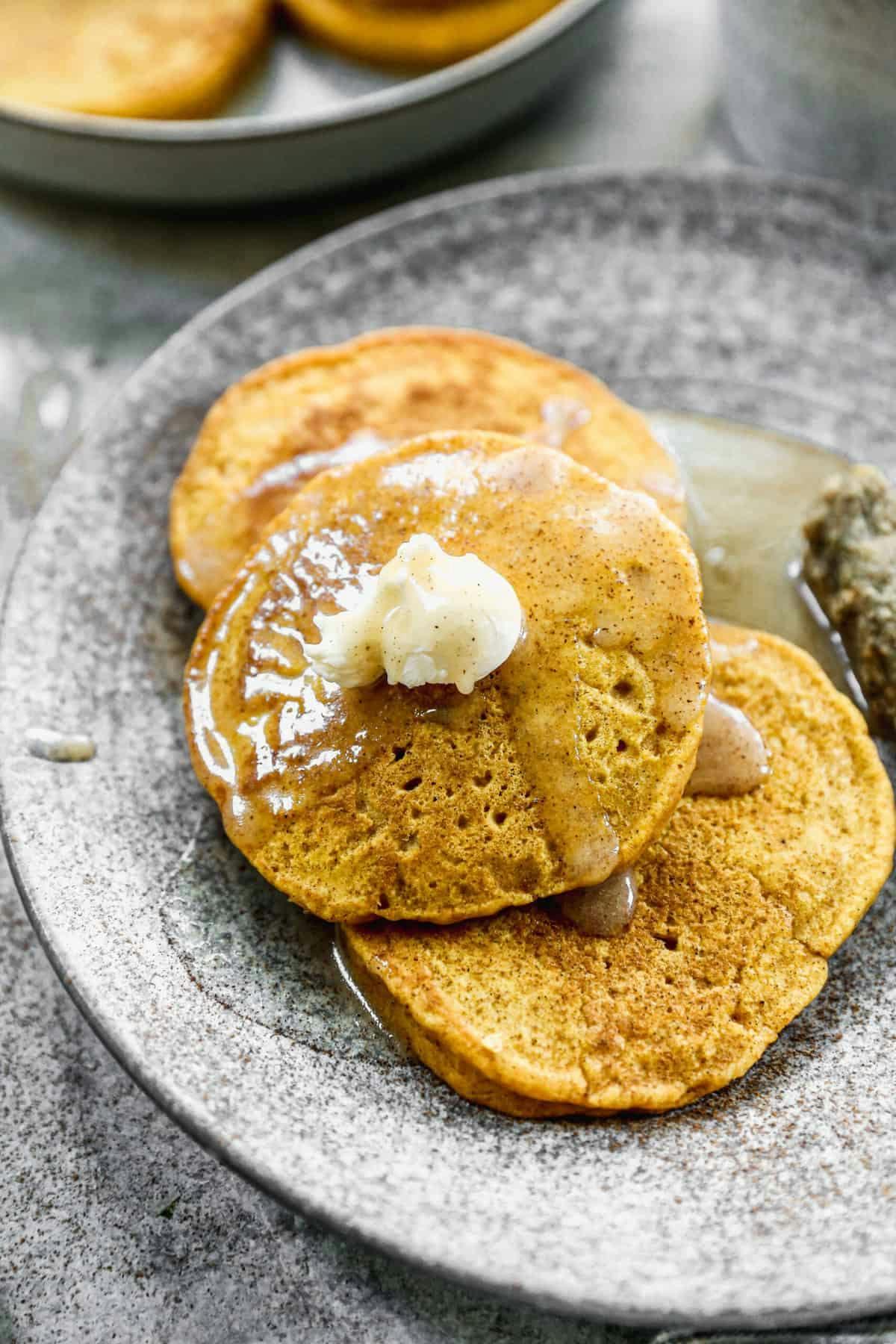 Pumpkin Pancakes with Cinnamon Syrup.