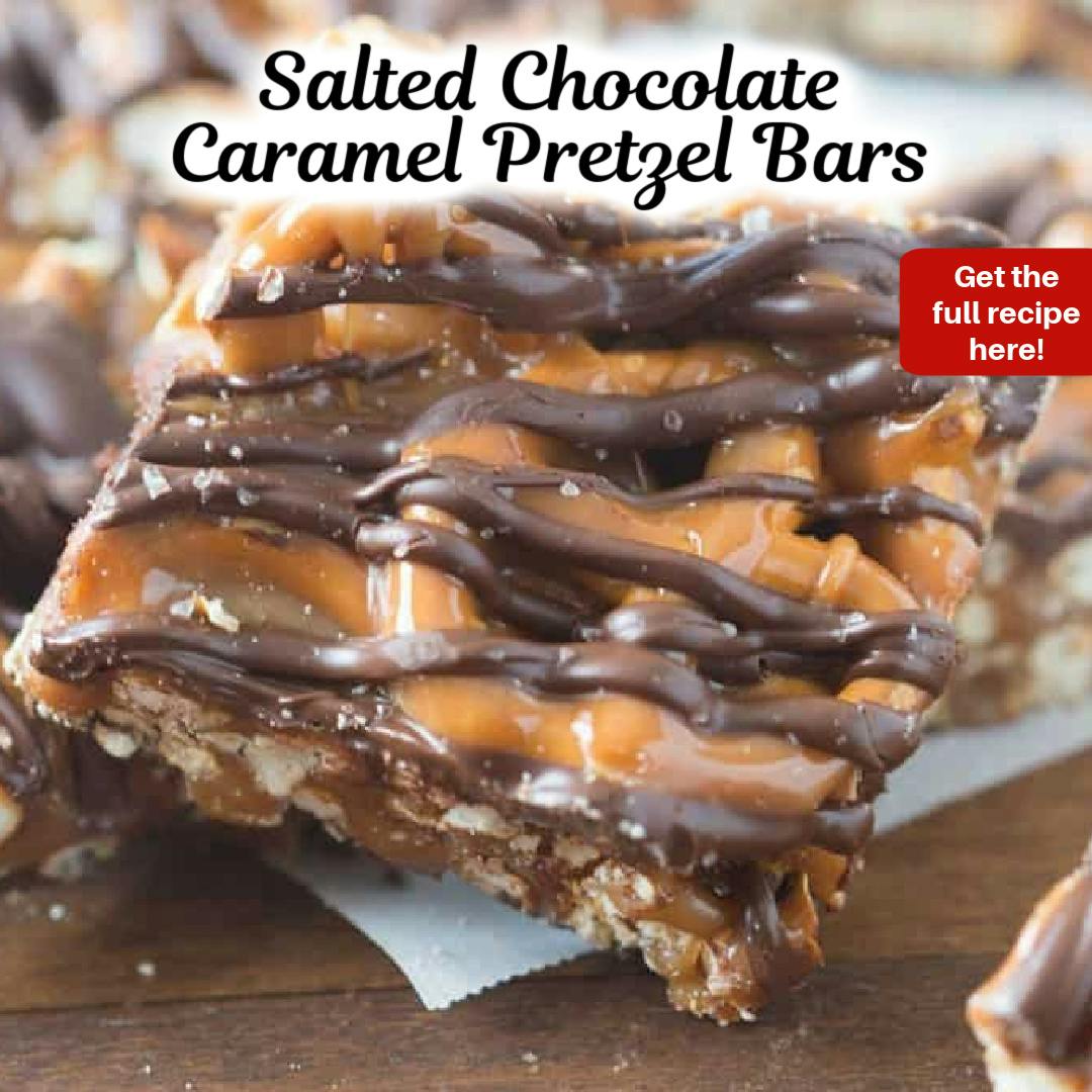 Salted Chocolate caramel pretzel bars stacked on a wood board