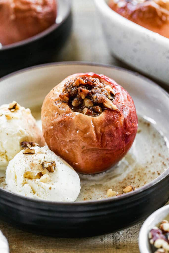 Baked Apples stuffed with cinnamon sugar, nut filling and baked until warm and caramelized. Served with a scoop of vanilla ice cream and caramel sauce on top. 