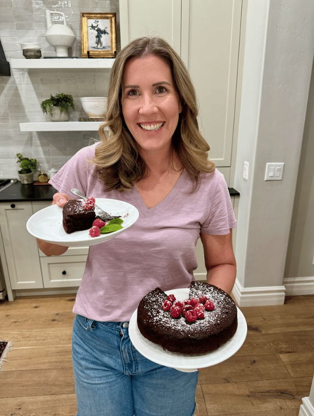 Lauren holding flourless chocolate cake.