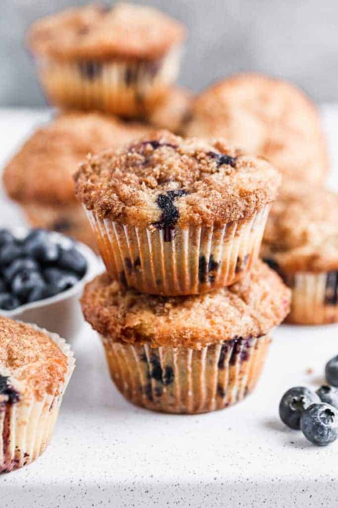 Blueberry Muffins stacked on a white plate
